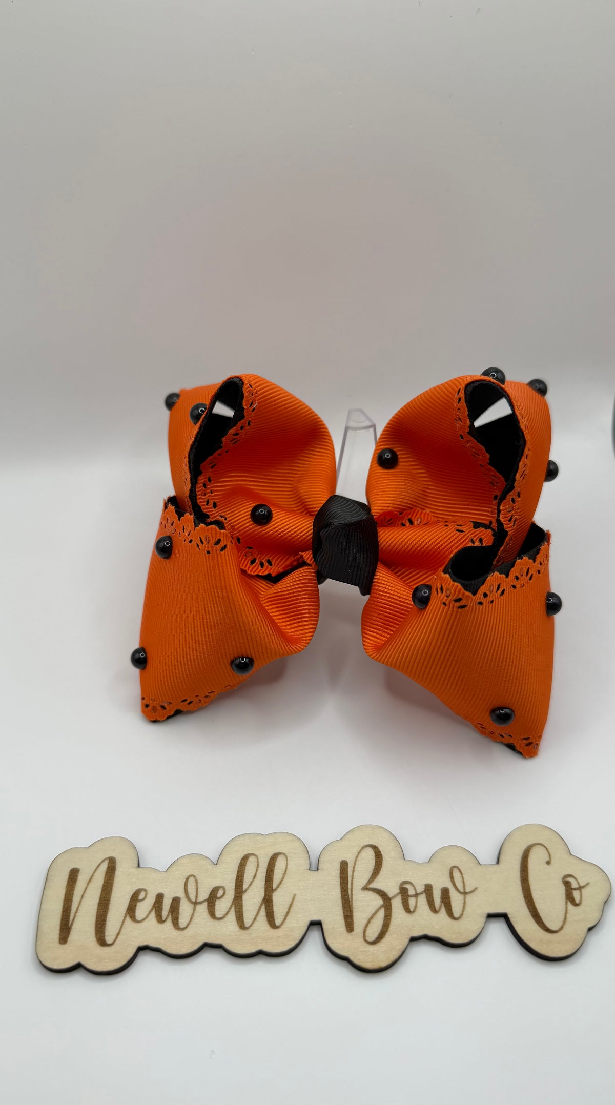 RTS 4inch orange bow with black pearls